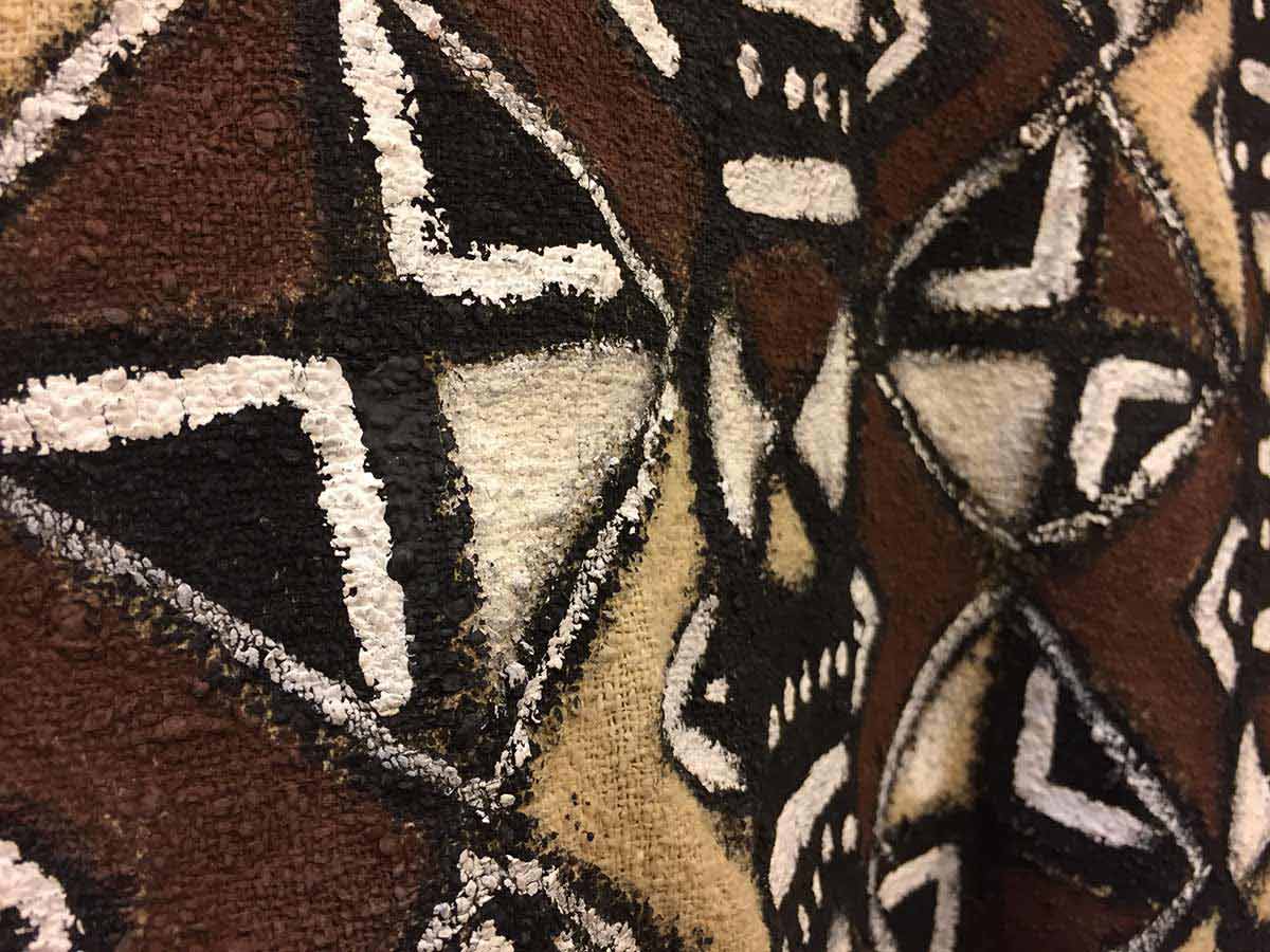 The wardrobe crew hand painted Athena’s shirt to replicated traditional mud cloth from Mali.